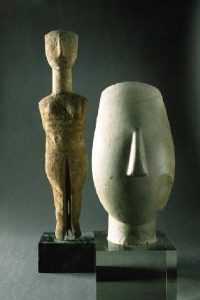 (Lto R) Figurine with crossed arms, Cycladic; head of a woman, fragment of a statue,from Keros Early Cycl