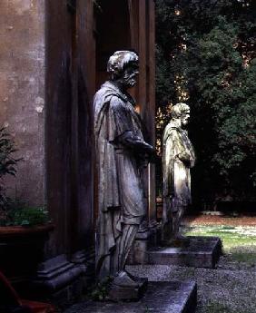 The main entrancedetail of two statues of prisoners on guard 16th centu
