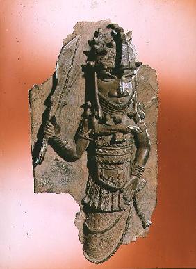 Plaque depicting the royal god Oba holding the eben sword in his right hand, dancing to honour his a possibly 1