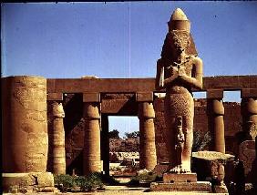 The Colossus of Ramesses II: standing statue of the king with his daughter Benta anta in front of hi c.1320-120