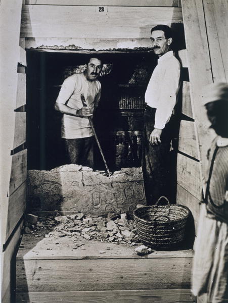 Howard Carter (1873-1939) and a colleague standing beside a partially demolished wall to one of the  von Harry Burton