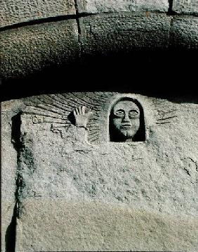 Relief depicting the head and face of a man, possibly God the Father, from the facade from the f