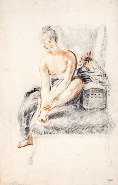 Semi-nude woman seated on a chaise longue, holding her foot (sanguine and black chalk on paper) von Jean Antoine Watteau