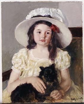 Françoise mit einem kleinen schwarzen Hund Um 1908