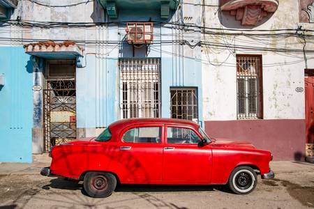 Red Oldtimer in Havana, Cuba. Street in Old Havana 2020