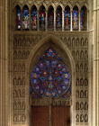 View looking west from the nave, rose window designed by Bernard de Soissons, with surrounding statu 1375