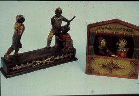 31:Cast iron mechanical banks; Dark Town Battery, Punch and Judy 1851
