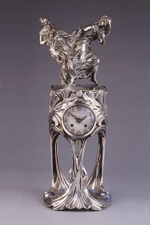 An Art Nouveau Silver-Patinated Bronze Clock Cast From Models By Maurice Dufrene (1876-1955) And Vou von 