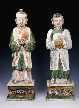 An Unusual Pair Of Glazed And Painted Pottery Figures Of Attendants von 