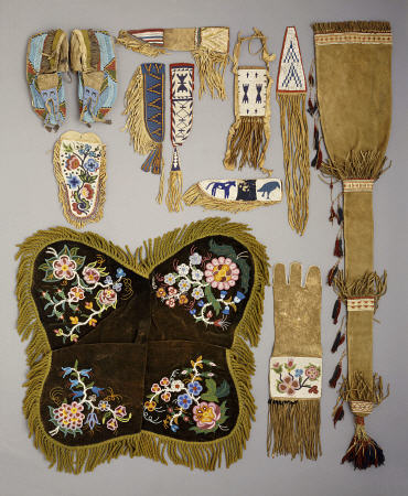 A Selection Of Native American Artefacts Including A Pair Of Sioux Beaded Moccasins And Skin Mirror von 