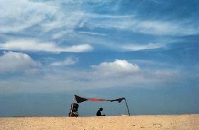 A lone fisherwomen waiting for her husband to return from sea at Gopalpur (photo) 