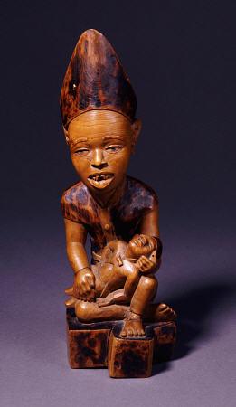 A Yombe Wood Carving Possibly Depicting A King Or Chief Presenting His Son