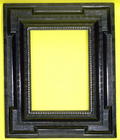 Alpine 17th century carved and ebonised frame with a projecting plane, inset extended corners and va 19th