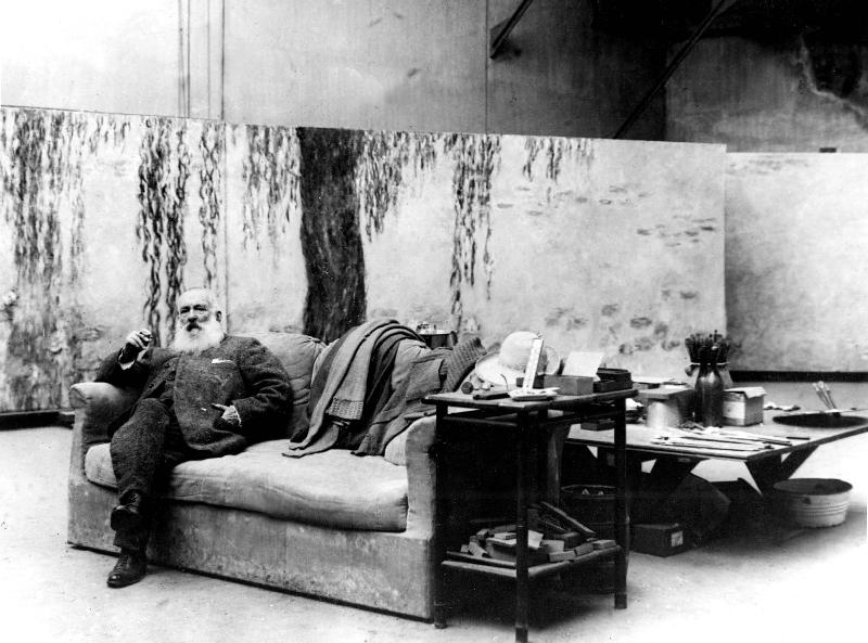 French painter Claude Monet in his workshop in front of one of his paintings Waterlilies von 