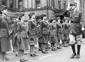 General Charles de Gaulle during review of young women of Free French Forces at Wellington barracks  July 14, 1