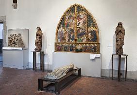 Interior of the gallery with an altarpiece and sculptures