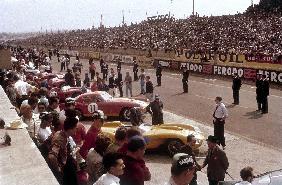 Le Mans racing circuit, France. The cars are lined up in the pits, with the spectator stands opposit 1959