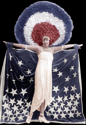Mistinguett wearing giant headgear in her show in Paris 1917