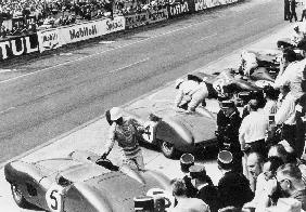 Start of the Le Mans 24 Hours, France, 1959. Roy Salvadori prepares to climb aboard his Aston Martin