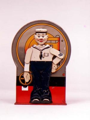Tin Mechanical bank in form of a sailor. When the lever is depressed, he stands to attention and sal von 