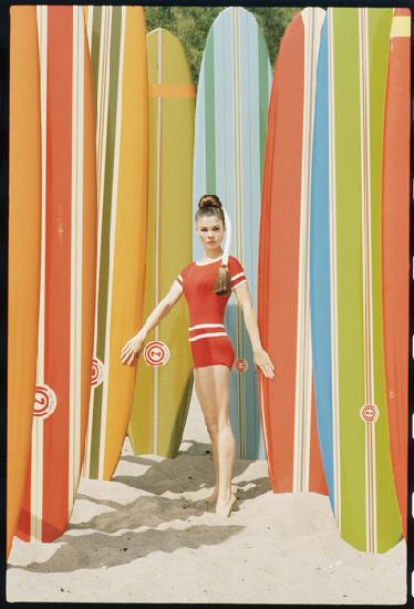 Actress Wende Wagner with surfboards on the beach in Malibu 1966