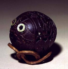 Coconut sculpted into a face c.1895