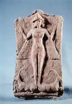 Plaque depicting a winged goddess, possibly Ishtar, standing on two ibexes, from Ras Shamra (Ugarit)