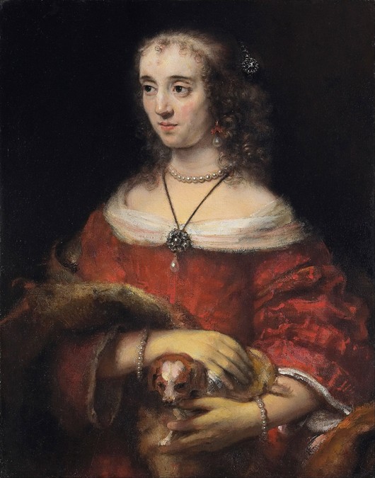 Bildnis einer jungen Frau mit Schoßhund von Rembrandt van Rijn