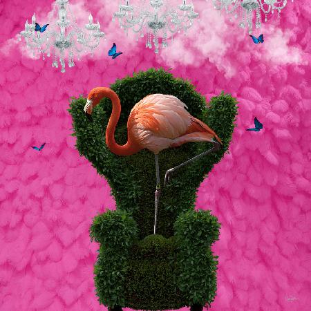 Flatternder rosa Flamingo auf einem grünen Stuhl
