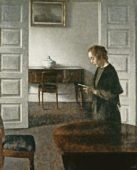 Interior with a Lady Reading c.1900